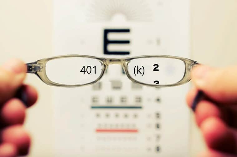vision test with hands holding glasses