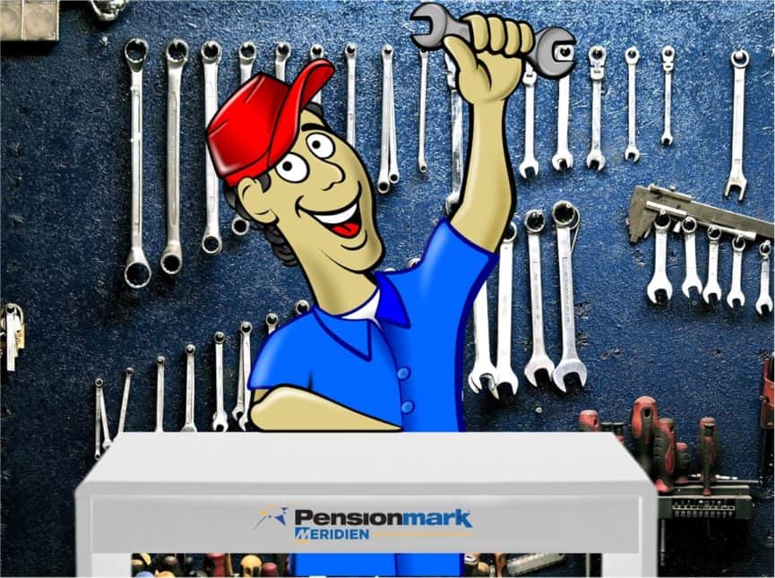 Tools on a wall with a mechanic holding a wrench